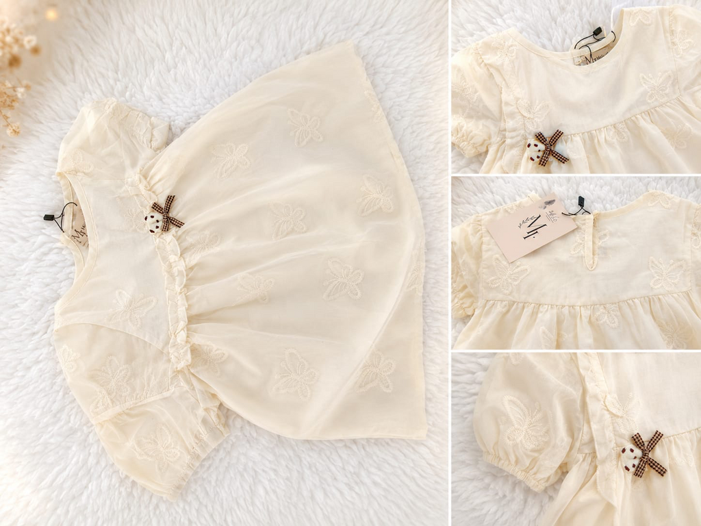 Ivory embroidered girls lawn frock with puff sleeves and bow detail